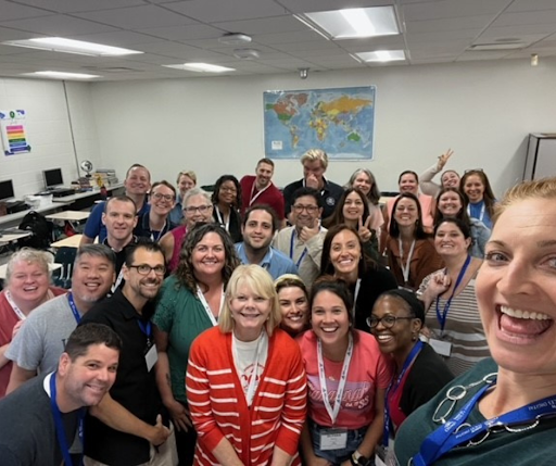 a group of teachers posing for a photo at the CI Summit