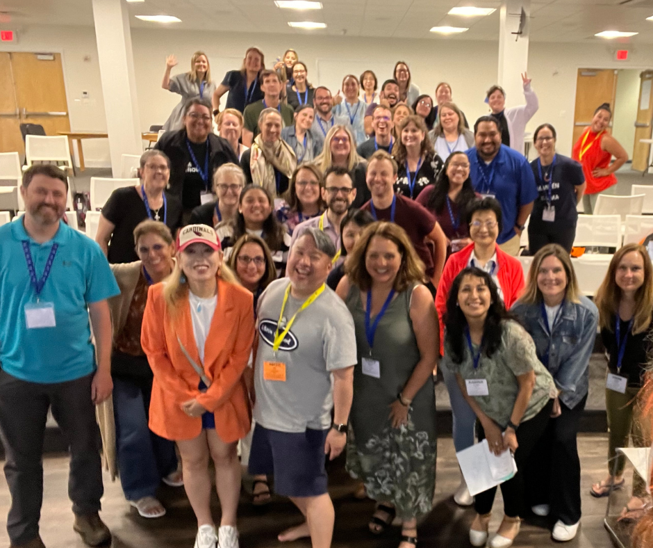 a group of teachers posing for a photo at the CI Summit